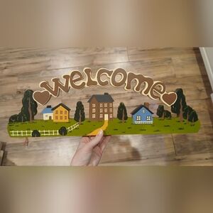 Charming Welcome Sign with Colorful Houses